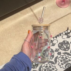 Glass Tumbler with Straw and Floral Accents